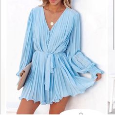 This Brand New Ruffle Romper Is Such An Adorable Piece To Add To Your Closet! It’s Of Course In Perfect Condition And Such A Beautiful And Unique Piece! Chic Pleated Jumpsuits And Rompers For Spring, Light Blue Jumpsuits And Rompers For Spring Party, Chic Light Blue V-neck Jumpsuits And Rompers, Chic Blue Jumpsuits And Rompers For Spring, Blue Jumpsuits And Rompers For Date Night In Spring, Rose Blue, Ruffle Romper, Rose Lights, Balloon Sleeves