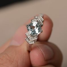 This is a gorgeous handmade creation. Its beauty is its simplicity & Elegance. The 7*7mm cushion cut faceted natural Aquamarine is crafted in solid sterling silver and with rhodium plated. All item is sent in a beautiful gift box If you have any idea of design your ring,pls contact me directly. You can realize more lovely stuff clicking the link https://www.etsy.com/shop/knightjewelry?refshopsection_shophome_leftnav Please leave the correct address and you phone number for delivering success Sterling Silver Cushion Cut Gemstone Rings, Sterling Silver Rings With Cushion Cut Gemstone, Cushion Cut White Gold Sterling Silver Ring, White Gold Asscher Cut Gemstone Ring, White Gold Sterling Silver Cushion Cut Sapphire Ring, Cushion Cut White Gold Sapphire Ring In Sterling Silver, White Gold Cushion Cut Sapphire Ring In Sterling Silver, White Gold Rings With Asscher Cut Gemstones, White Gold Cushion Cut Sapphire Ring