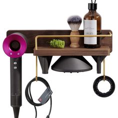 a wooden shelf with various items on it and a hair dryer next to it