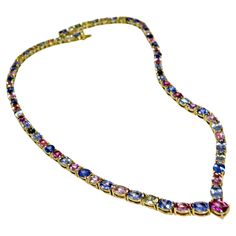 The stunning one-of-a-kind multicolor sapphire necklace features yellow, peach, green, pink, and blue oval cut Burmese natural sapphires Ranging from medium-light to saturated in hue while weighing in a total of 50.00 carats, 18 karats yellow gold. Natural unheated - Untreated Burma blue, pink, yellow sapphires. 18"L. Box clasp. Total Necklace Weight: 36.7 grams Condition: New 100% NATURAL Guaranteed ~ One of a Kind~ Sapphire Diamond Necklace, Diamond Necklace Wedding, Gold Drop Necklace, Silver Link Necklace, Rainbow Sapphires, Gold Link Chain, Emerald Bead, Solitaire Pendant Necklace, Purple Sapphire