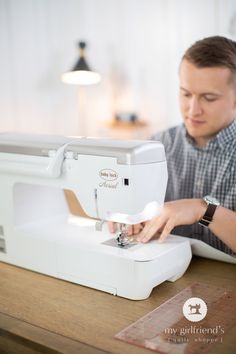 a man is working on a sewing machine