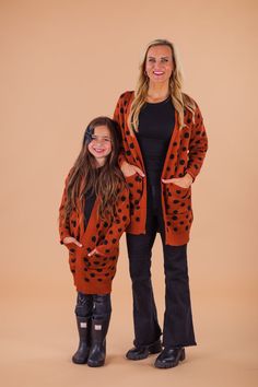 EACH CARDIGAN SOLD SEPARATELY!*Please refer to size chart for the best fit* Long sleeves makes it a perfect pick all Fall / Winter Mom & child tops both feature trendy polka dot print with pockets Ultra soft material for comfort & ease Open front design makes for easy layering Twinning is winning, especially with your little mini me. These Polka Dot Cardigans feature long sleeves and an allover orange polka dot design. In a versatile pattern, this cardigan sweater is made from soft and cozy fabric that will keep her comfy during all adventures. She can pair it with a variety of SIP bottoms & our booties for the perfect look! Little ones love to match their mommy! bullets:Includes: Cardigan only 100% Acrylic Polka Dot Cardigan, Children Top, Cozy Fabric, Polka Dot Design, Dot Design, Mom Kid, Polka Dot Print, Mini Me, Dot Print