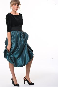 Tale: Pull on our Enoki Puffball Skirt for an evening extravaganza. The deep side pockets are a must on a night out and these can fit your phone as well as all of your other essentials. The gorgeous deep waistband cinches in your waist without being tight and this skirt is fully lined with soft jersey for ultimate comfort. The crisp teal taffeta gathers beautifully at the waist adds volume to the skirt that captures the light beautifully and makes you sure to stand out from the crowd. Our model is 5ft 9" and wears an S with our Primrose Top. Please see our size guide. 100% Polyester Taffeta, 95% Cotton 5% Elastane waistband and 95% Viscose 5% Lycra lining. Made in Britain Wash at 30* Warm Tumble Dry Warm Iron Do Not Bleach Do Not Dry Clean Puffball Skirt, Small Frocks, Taffeta Skirt, Stocking Fillers For Her, You Sure, Independent Designers Fashion, The Deep, Jacket Sale, Bridal Collection