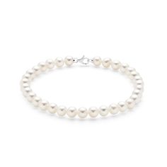 Elevate your jewelry collection with this luxurious freshwater pearl bracelet, featuring 6mm natural pearls and a stunning 18K white gold lobster clasp. The pearls’ larger size provides a bold yet elegant statement, making this bracelet perfect for both day and evening wear. The radiant white gold clasp adds a touch of sophistication, ensuring the bracelet stays securely in place. This piece is ideal for those who appreciate classic design with a modern twist. Treat yourself or a loved one to th Akoya Pearl Bracelets In Pearl White With Round Beads, White Gold Pearl Bracelets With Round Beads, Single Strand Round Akoya Pearl Bracelet, Single Strand Akoya Pearl Bracelet, Timeless White Gold Pearl Bracelet, Luxury Single Strand Pearl Bracelet With Round Beads, Luxury Single Strand Pearl Bracelet, Classic White Gold Pearl Bracelet With Oyster Clasp, Classic Single Strand Akoya Pearl Bracelet