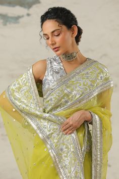 Green saree embellished with intricate hand embroidery, using applique and aari technique in metallic silver. Comes with plain silver unstitched blouse piece. - Aza Fashions Bollywood Blouse Piece With Mirror Work For Eid, Pista Green Saree With Dupatta For Reception, Pista Green Blouse Piece With Cutdana And Traditional Drape, Eid Chanderi Blouse Piece With Mirror Work, Unstitched Blouse Piece With Mirror Work For Reception, Tissue Silk Blouse Piece With Mirror Work For Festivals, Pista Green Pre-draped Saree With Resham Embroidery For Reception, Silk Dupatta With Mirror Work For Reception, Traditional Drape Pista Green Blouse Piece With Cutdana