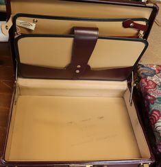 an open suitcase sitting on top of a wooden floor