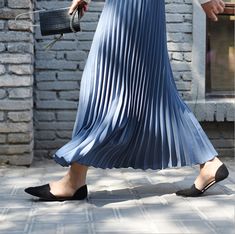 Exude elegance and class in our Solid Pleated Maxi Skirt. Featuring a long fit and elasticated waistband, this skirt is sure to keep you feeling comfortable and looking stylish all day long. Perfect for everyday wear, this versatile piece may be paired with a sweater or blouse for an effortlessly chic look to wear for casual days out or in formal settings. Stretch Pleated Midi Skirt, Fitted Blue Bottoms With Accordion Pleats, Blue Skirted Bottoms With Pleated Hem, Stretch Lined Midi Pleated Skirt, Long Stretch Pleated Skirt With Elastic Waistband, Stretch Midi Pleated Skirt With Lining, Blue Casual Bottoms With Accordion Pleats, Casual Blue Bottoms With Accordion Pleats, Stretch Accordion Pleat Skirt For Summer