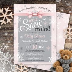 a baby shower is shown with snowflakes and a teddy bear