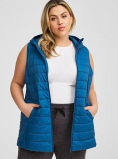 FIT Model is 5'9” wearing size 1. Measures 32” from shoulder (size 2). MATERIALS + CARE Cotton-blend fabric. . 100% nylon. Machine wash cold. . Imported. DETAILS Collared neckline. . Sleeveless. . Zip front. . The best plus size women's light packable puffer vest vests in blue opal made of nylon. Torrid is your destination for cozy fall and winter clothes to keep you warm and comfortable. Winter Puffer Vest, Black Dating, Casual Outerwear, Perfect Date, Casual Vest, Long Torso, Winter Clothes, Cozy Fall, Puffer Vest