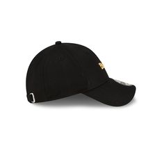 a black hat with gold logo on the front and side panel, sitting against a white background