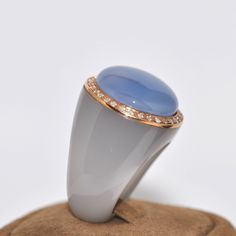 Elegant Oval Cabochon Moonstone Ring, Elegant Yellow Gold Rings With Natural Stones, Elegant Yellow Gold Ring With Natural Stones, Elegant Moonstone Ring For Anniversary, Elegant Blue Oval Cabochon Moonstone Ring, Elegant Moonstone Ring With Natural Stones For Anniversary, Formal Fine Jewelry Chalcedony Rings, Formal Chalcedony Rings Fine Jewelry, Formal Chalcedony Rings In Fine Jewelry Style