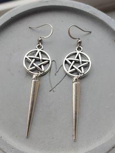 Gothic/emo style pentagram and spike earrings in silver. Sold as a pair.  Earhooks are made of stainless steel so are hypoallergenic. Pentagram and spike charms are made of iron alloy. Spikes measure:34mm Pentagram charms measure 14mm Comes gift wrapped 🖤 Nickel Free Alternative Silver Jewelry, Alternative Style Nickel-free Silver Jewelry, Nickel-free Alternative Silver Jewelry, Nickel-free Silver Alternative Jewelry, Nickel-free Silver Jewelry For Alternative Fashion, Nickel Free Dangle Punk Piercings, Alternative Style Dangle Earrings For Gift, Nickel Free Punk Earrings For Festivals, Alternative Metal Pierced Earrings