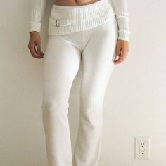 This Zip Hoodie And Low Rise Pant Set is ideal for lounging at home or casual outings during cooler weather. Featuring a soft zip-up hoodie and stylish low-rise pants, it offers comfort and a fashionable look without sacrificing ease of movement. Made from a cloud-like knit fabric blend, this two-piece set adds a touch of warmth and style to your wardrobe. Made from a soft and stretchy polyester-spandex blend for all-day comfort. The hoodie features ribbed cuffs and a waistband, with a functiona Jumpsuit Winter, Sweatpants Women, Low Rise Pants, Flowy Design, Frankies Bikinis, Cooler Weather, Dress Robes, Knit Set, Pant Set