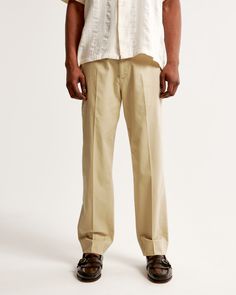 On-trend pants in our clean twill fabric and loose fit through the leg, for a wider silhouette. Features permacrease pleating details, pockets throughout with hidden cellphone pocket and button and fly closure. Male Features, Trend Pants, Twill Pants, Twill Fabric, Color Khaki, Mens Bottom, Abercrombie Fitch, Mens Pants, Loose Fitting