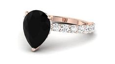 a rose gold ring with an oval black diamond surrounded by round brilliant cut white diamonds