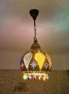 a colorful light hanging from the ceiling in a room