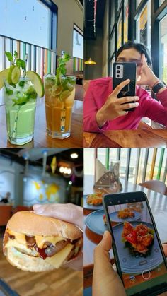 a woman taking a selfie with her cell phone while sitting at a table full of food and drinks