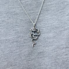 925 Sterling Silver Snake and Rose pendant necklace. The rose and snake design are the ultimate symbol of temptation. They also represent loss of innocence and beauty. Available in 24K Gold Plate https://etsy.me/2MmNwBs Chain length 16 inches / 40.6 cm 18 inches / 45.7 cm 23.5 inches / 60 cm 31.5 inches / 80 cm Every piece is handcrafted in Bali and made with Intention, Love, and Soul so that it can be felt by its wearer and ultimately change our energy and lives in a positive way. Each with its Loss Of Innocence, Rose Sculpture, Snake Necklace Silver, Fantasy Necklace, Snake Pendant, Trendy Fashion Jewelry, Tiffany Jewelry, Snake Necklace, Snake Design