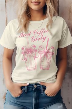 Vintage Ice Coffee Girl Graphic TeeBella Canvas Tees. This item is made entirely from eco-friendly materials. It has a unisex fit that is true to size, with a crew neck and short sleeves. The shirt is crafted from superior combed and ring-spun cotton, with a 32 single 4.2 oz. Weight. It is side-seamed and has a retail fit, with shoulder taping for added comfort. The print is created using high-quality water-based ink, which is eco-friendly and leaves a soft touch on the fabric.Fabric Contents: 1 Trendy Coffee Relaxed Fit Top, Casual Coffee Crew Neck Top, Trendy Relaxed Fit Coffee Top, Coffee Color Short Sleeve Top With Text Print, Summer Coffee Colored Tops With Graphic Print, Coffee Color Crew Neck Top With Screen Print, Coffee Color Graphic Tee Shirt With Short Sleeves, Coffee Colored Short Sleeve Top With Graphic Print, Trendy Coffee Short Sleeve Tops