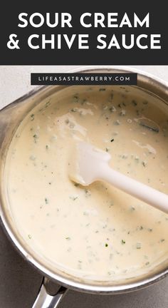 a sauce in a pot with a white spatula on top and the words sour cream and chive sauce above it