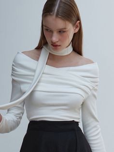 Editor's NoteThis product showcases a shirred off-shoulder design paired with a tie, providing a subtle point of interest that accentuates the neck and neckline. Made with a stretchable material, it offers comfort and allows for various stylings to enhance a feminine mood.- The combination of the off-shoulder design with shirring and a tie adds a delicate highlight to the neckline.- It is crafted to enhance the neck's contour, drawing attention with its unique style.- Using stretchy fabric, the garment ensures a comfortable fit for the wearer.- Designed with versatility in mind, it can be styled in multiple ways to emphasize a feminine look.Measurements(in.)Size: One Size (XS-M)- Shoulder: 15.75- Chest: 13.39- Sleeve Length: 20.47- Armhole: 5.91- Total Length: 20.87- Tie Length: 52.76* Mod Elegant Stretch Off-shoulder Top, Elegant One Shoulder Stretch Blouse, Elegant One-shoulder Stretch Blouse, Elegant Stretch Off-shoulder Top For Evenings, Chic Fitted Off-shoulder Top With Elastic Shoulders, Chic Off-shoulder Top With Elastic Shoulders, Elegant White Off-shoulder Top For Fall, Elegant Blouse With Stretch And Asymmetrical Neckline, Elegant Blouse With Asymmetrical Neckline And Stretch