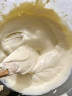 a mixing bowl filled with batter and cream