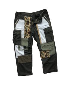 "Description: Uniqueness is here for those who love‼️ It's originally military pants in olive green herringbone pattern. Then, it's artistically full hand reworked and patched using several fabric materials and patterns, in order to make it unique and precious. However, its cargo style still remains as original since it contains multiple pockets like other military pants. Photos and videos describes the product better. So, just have a look-see at them all and read the special features below before you decide to purchase it.  Features: - Patchwork military pants. - Reworked cargo pants with multiple pockets. - Different fabric patterns and materials were patched as detailing.  - Full hand sewing stitches. - Herringbone pattern fabric. - Relaxed fit. Size: Waist: 33 - 37\" (Adjustable)  Hips Military Color, Military Pants, Denim Patches, Cargo Style, Vintage Military, Herringbone Pattern, Pant Shirt, Different Fabrics, Chinos Pants