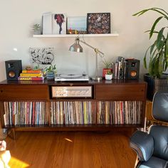 a living room filled with furniture and a record player on top of a wooden table