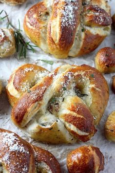 several different views of baked breads with cheese and herbs