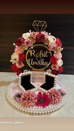 a cake decorated with flowers and jewels