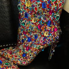 Stunning!! Brand New, Step Into Style With These Glamorous Jewel Tone Boots. Multi Color Stones On Entire Boots With Side Zipper. Surprisingly Very Comfortable! Note: I Had Added Additional Black Stretch Fabric Added To Zipper To Make Ankle And Leg Area More Comfortable, If Your Legs Are On The Larger Size These Are Perfect For You, Or You Can Have A Shoe Craftsman To Remove. Multicolor Round Toe Boots For Party, Multicolor Round Toe Heels For Party, Multicolor Round Toe Party Heels, Glamorous Multicolor Rhinestone Heels, Multicolor Pointed Toe Party Boots, Colorful Pointed Toe Heels For Party, Multicolor Closed Toe Boots For Party, Multicolor High Heel Party Boots, Pink Embellished High Heel Boots