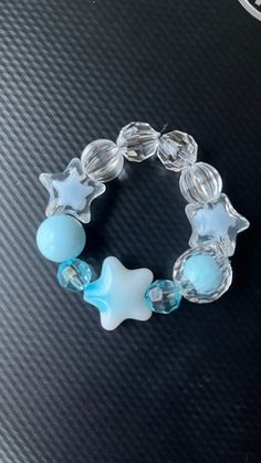 Blue star child size bracelet. Blue Star Charm Bracelet, Blue Bracelets With Star Charm And Round Beads, Blue Handmade Star-shaped Beaded Bracelets, Blue Beaded Bracelets With Star Charm For Gift, Trendy Blue Star-shaped Jewelry, Trendy Star-shaped Blue Jewelry, Blue Beaded Bracelets With Star Charm, Handmade Blue Star-shaped Bracelet, Star-shaped Adjustable Crystal Bracelet