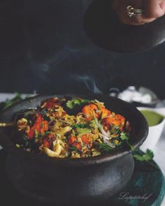 a person is stirring some food in a bowl