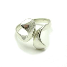 Sterling silver ring - R000252. Stamped 925. Approximate weight 4.4 grams. Top width 2.0 cm (0.80 inches). All our jewels are made from solid sterling silver 925/1000 and are carefully crafted by hand in our family workshop. We dispatch your orders in 5 working days, worldwide and the postage is $5. We ship registered priority mail. Please allow 5-7 working days for delivery in Europe and 10-15 working days outside Europe. For any questions - please do not hesitate to contact me! Modern Silver Rings Hallmarked, Modern Sterling Silver Bypass Ring For Anniversary, Modern Hallmarked Sterling Silver Rings, Modern Hallmarked Silver Rings, Sterling Silver Concave Ring Stamped 925, Modernist Sterling Silver Rings For Formal Occasions, Sterling Silver Modernist Rings For Gifts, Sterling Silver Modernist Promise Ring, Modern Silver Bypass Ring For Formal Occasions