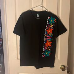 Size Medium. 100% Cotton. Hand Embroidered T-Shirt. Color Black. Will Bundle With Any Other Items In My Closet. Black Embroidered Cotton Shirt, Multicolor Embroidered Cotton T-shirt, Black Cotton T-shirt With Embroidered Text, Black Embroidered Crew Neck Shirt, Casual Multicolor Embroidered Short Sleeve T-shirt, Casual Black Shirt With Floral Embroidery, Multicolor Embroidered Text Crew Neck T-shirt, Spring Crew Neck T-shirt With Machine Embroidery, Black Crew Neck Top With Custom Embroidery