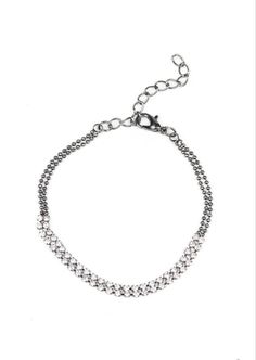 This edgy gunmetal custom choker set comes with a necklace and complimentary earrings, upgraded earrings, a clasp bracelet, and a ring with a stretchy back. Necklace - "What A Stunner": Featuring sleek fittings, dainty white rhinestones link with sections of glistening gunmetal chain around the neck. Shiny gunmetal beads dangle from the chain for a flirtatious finish. Features an adjustable clasp closure. Includes one pair of matching earrings. Upgraded earrings - "Fiercely Flauntable": Rows of Elegant Gunmetal Jewelry In Stainless Steel, Elegant Gunmetal Stainless Steel Jewelry, Adjustable Dainty Metal Body Jewelry, Silver Dainty Metal Body Jewelry, Adjustable Trendy Metal Body Jewelry, Silver Dainty Body Jewelry, Dainty Silver Metal Body Jewelry, Elegant Stainless Steel Jewelry In Gunmetal, Party Jewelry With Adjustable Gunmetal Chain