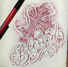 a drawing of a cross with the word jesus written in cursive writing on paper