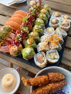 sushi platter with various types of food on it