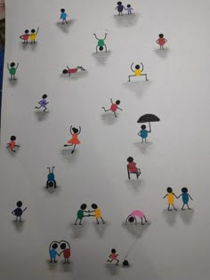 a group of people holding umbrellas on top of a white board with stickers