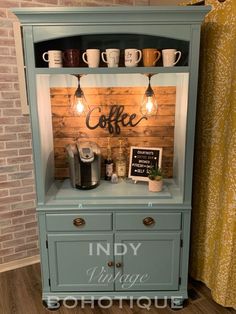 a coffee bar made out of an old hutch with lights on the top and bottom