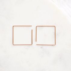 Dainty, delicate, simple. Your perfect choice for the everyday go-to pair of earrings. You can wear these as a square or a diamond! Dimensions: 1" Wide These earrings are 100% handmade Made with 18 gauge wire which is slightly thicker than the average ear wire. You can choose from sterling silver, 14k gold fill, or rose gold fill Handmade in Charlotte NC Eye Earrings, Charlotte Nc, Ear Wire, Sliders, Or Rose, Gold Filled, Rose Gold, Sterling Silver, Square