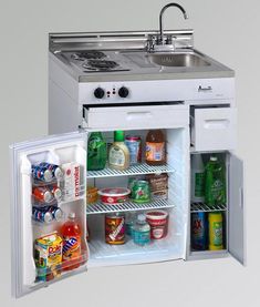 an open refrigerator with the door wide open and food in it's bottom compartment