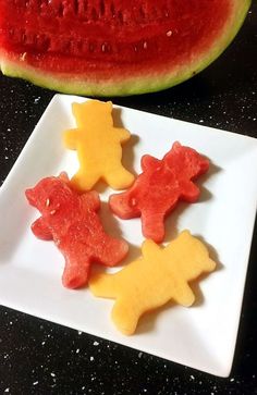 watermelon slices and pieces of fruit on a plate