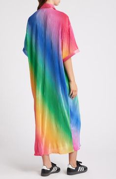 Rainbow-gradient hues and an oversized fit bring feel-good comfort to this pleated shirt dress that will radiate prismatic energy wherever you go. Front button closure Spread collar Elbow-length sleeves 95% polyester, 5% spandex Hand wash, line dry Imported Oversized Pleated Dresses For Summer, Long Pleated Summer Dresses, Spring Beach Dresses In Gradient Colors, Spring Vacation Gradient Dress, Gradient Spring Vacation Dress, Casual Ombre Dress For Spring, Oversized Multicolor Summer Dress, Oversized Pleated Summer Dress, Oversized Long Multicolor Dress