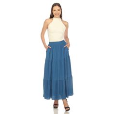 Elevate your fashion game with this flowy and effortlessly chic skirt. This maxi skirt from White Mark boasts a pleated design that adds texture, movement, and a touch of sophistication to your look. Dress it up or down as this skirt is incredibly versatile. Pair it with a tucked in blouse and heels for a sophisticated look or go for a more relaxed vibe with a tucked in tee and sandals and pair it with a jacket on chilly days. It’s perfect for various occasions and style preferences. Maxi Skirt Fall, Grey Maxi Skirts, Olive Skirt, Chic Skirt, Blue Maxi Skirt, Grey Maxi, Tiered Midi Skirt, Chic Skirts, Tiered Maxi Skirt