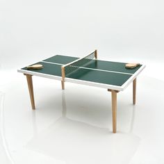 a ping pong table with two paddles on it