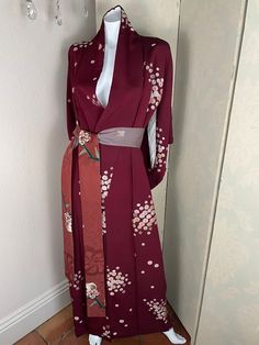 Silk crepe burgundy Japanese kimono with floral details and contrasting obi belt, fully lined in silk. One size fits most. Gothic Japanese Kimono, Elegant Red Wrap Kimono, Formal Spring Kimono With Kimono Sleeves, Vintage Fitted Kimono With Kimono Sleeves, Fitted Silk Kimono With Floral Print, Elegant Long Kimono For Tea Ceremony, Elegant Kimono With Kimono Sleeves For Tea Ceremony, Elegant Fitted Kimono With Floral Print, Elegant Long Sleeve Kimono For Tea Ceremony