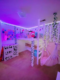 a bedroom with bunk beds and lights on the ceiling, along with other furniture in it