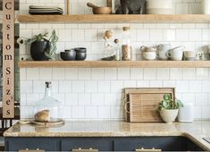 the shelves in this kitchen are filled with pots, pans, and other items