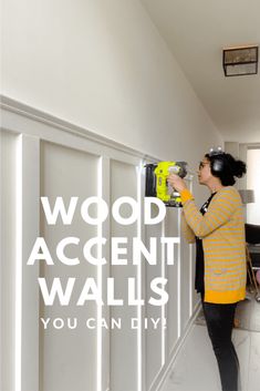 a woman using a driller on the wall with text overlay that reads wood accent walls you can diy